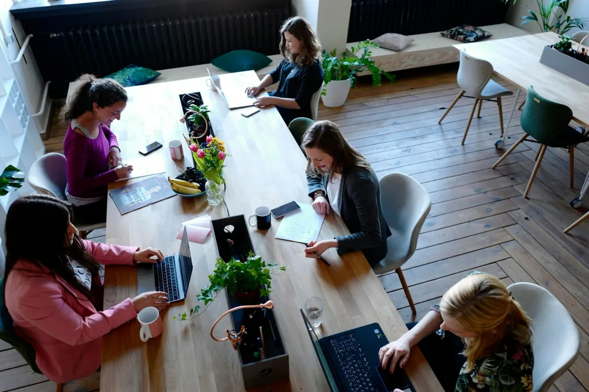 A team collaborating around a table, the shape of DAO work