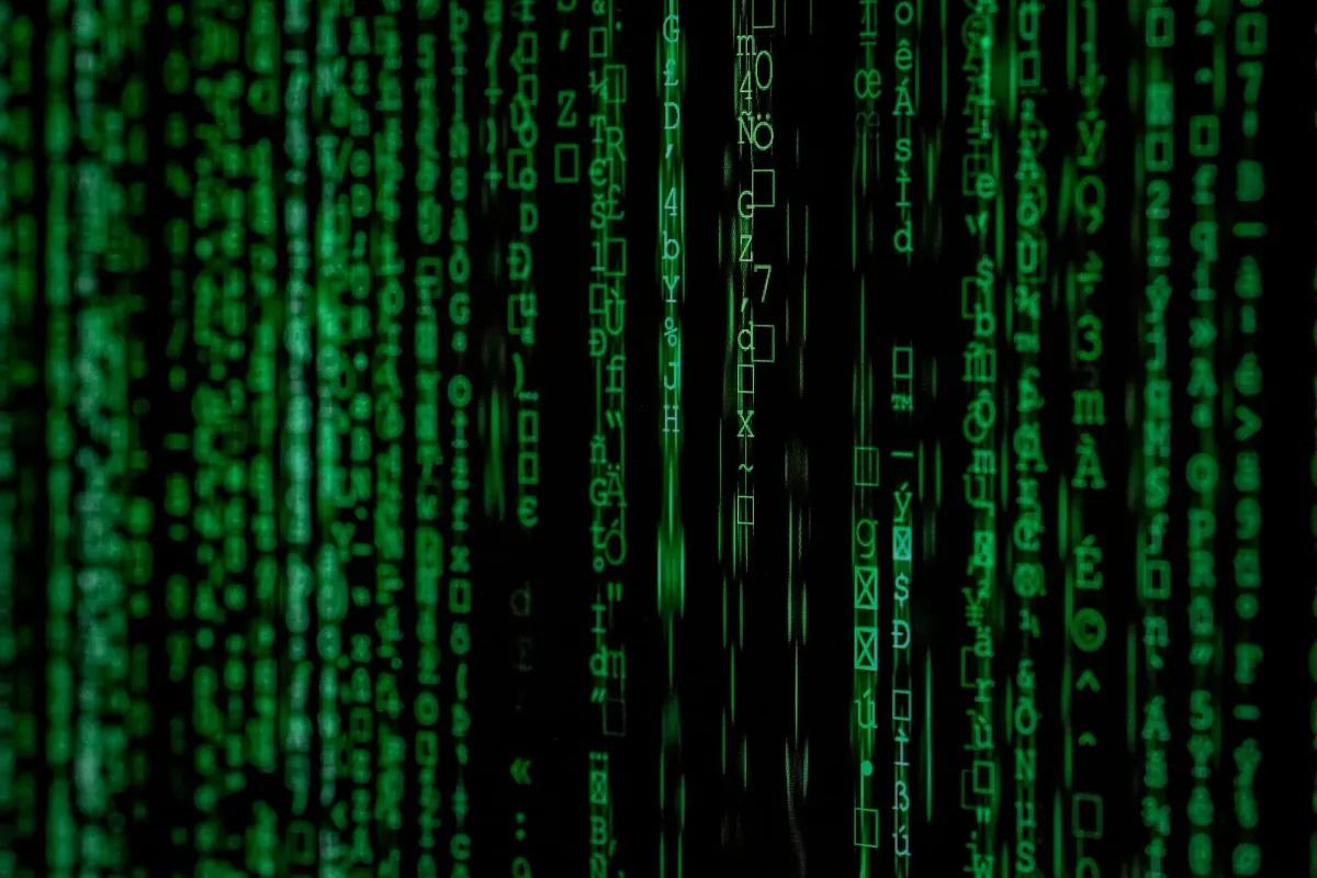 Cascading green code on a dark screen, building as a DeFi developer