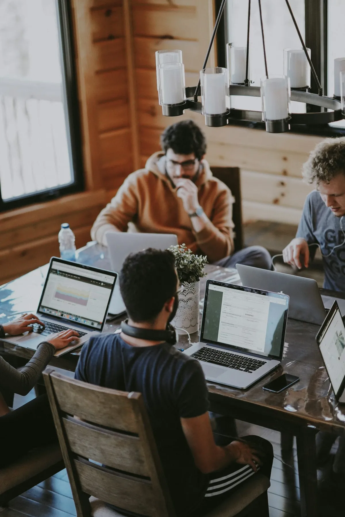 Developers working side by side on laptops, engineering blockchain protocols