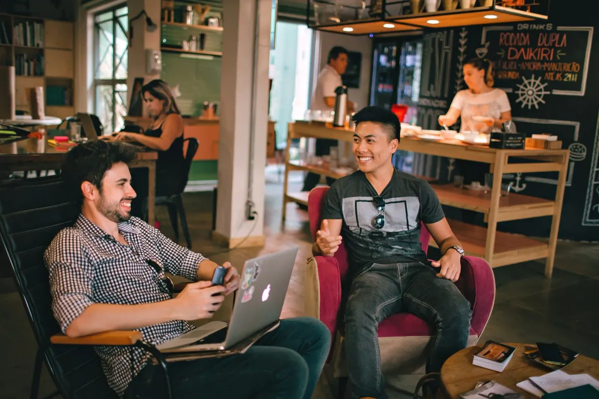 Two people talking while seated on chairs, a web3 job interview in progress