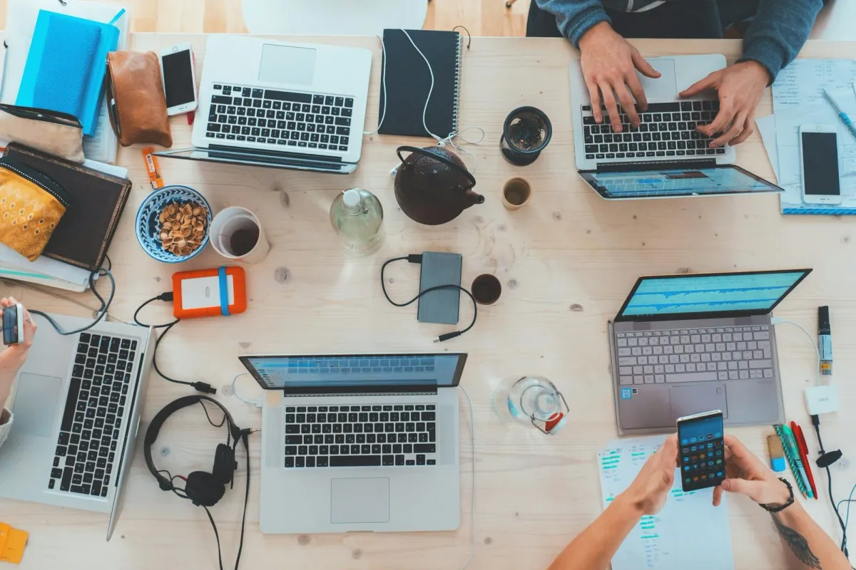 Students working together at a table of laptops, part-time web3 jobs for students