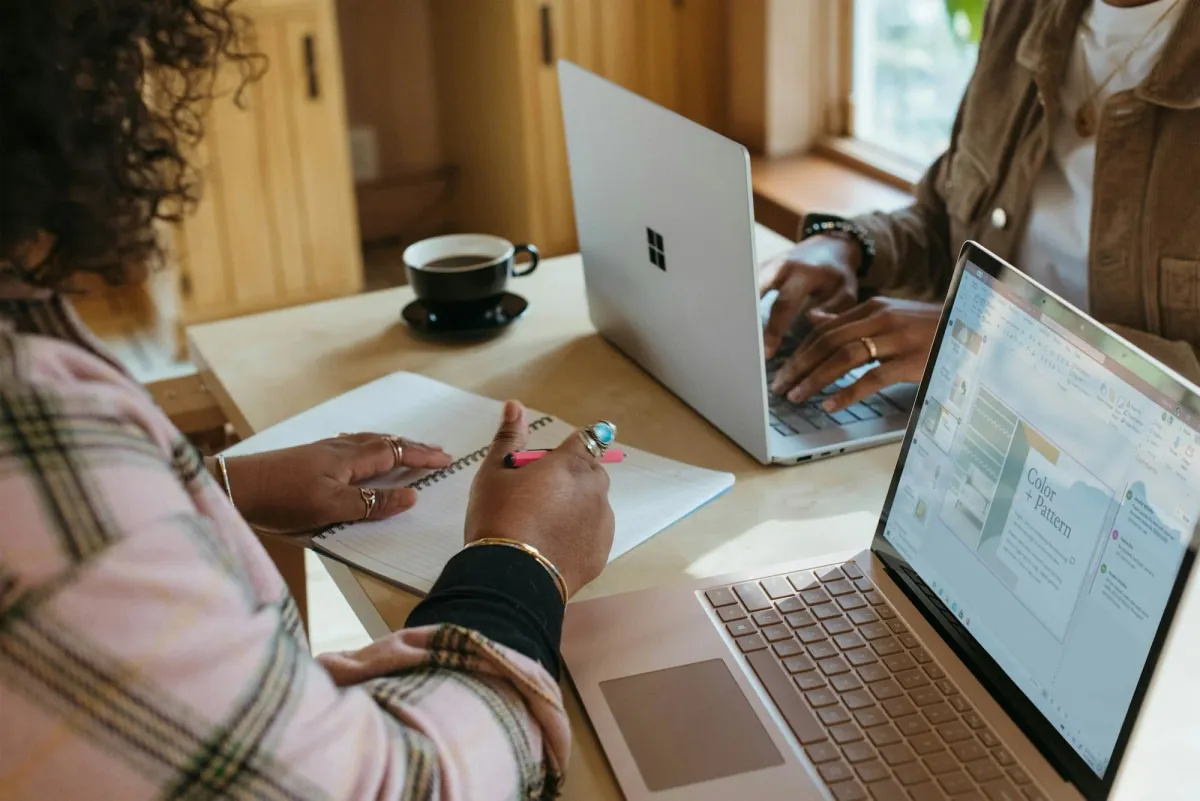 A person building a project on a laptop, a web3 portfolio that gets hired