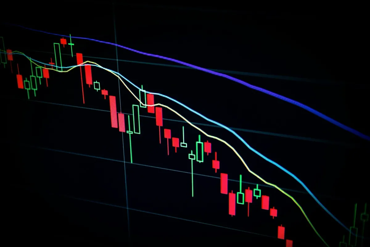 A market candlestick chart on a dark screen, the stakes of a web3 salary negotiation