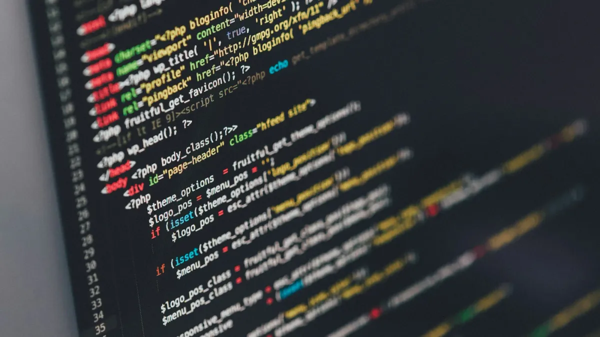 Lines of colorful source code filling a dark monitor