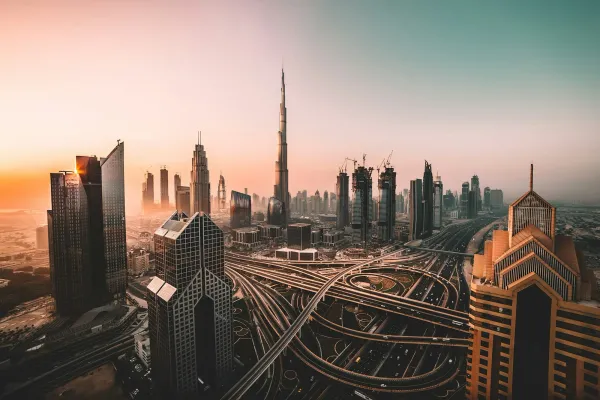 Aerial view of the Dubai skyline with the Burj Khalifa at sunset