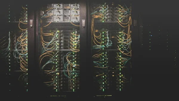 Rows of server racks glowing with network cables and lights