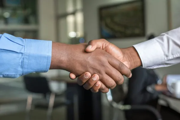 Close-up of a business handshake in an office