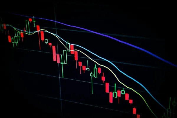 A market candlestick chart on a dark screen, the stakes of a web3 salary negotiation
