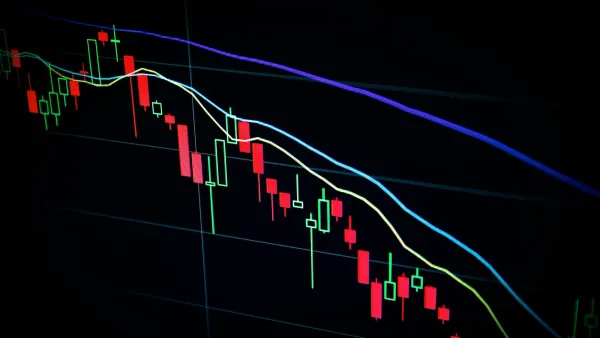 Candlestick price chart with moving average lines on a dark screen