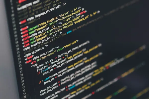 Colorful lines of source code on a dark screen